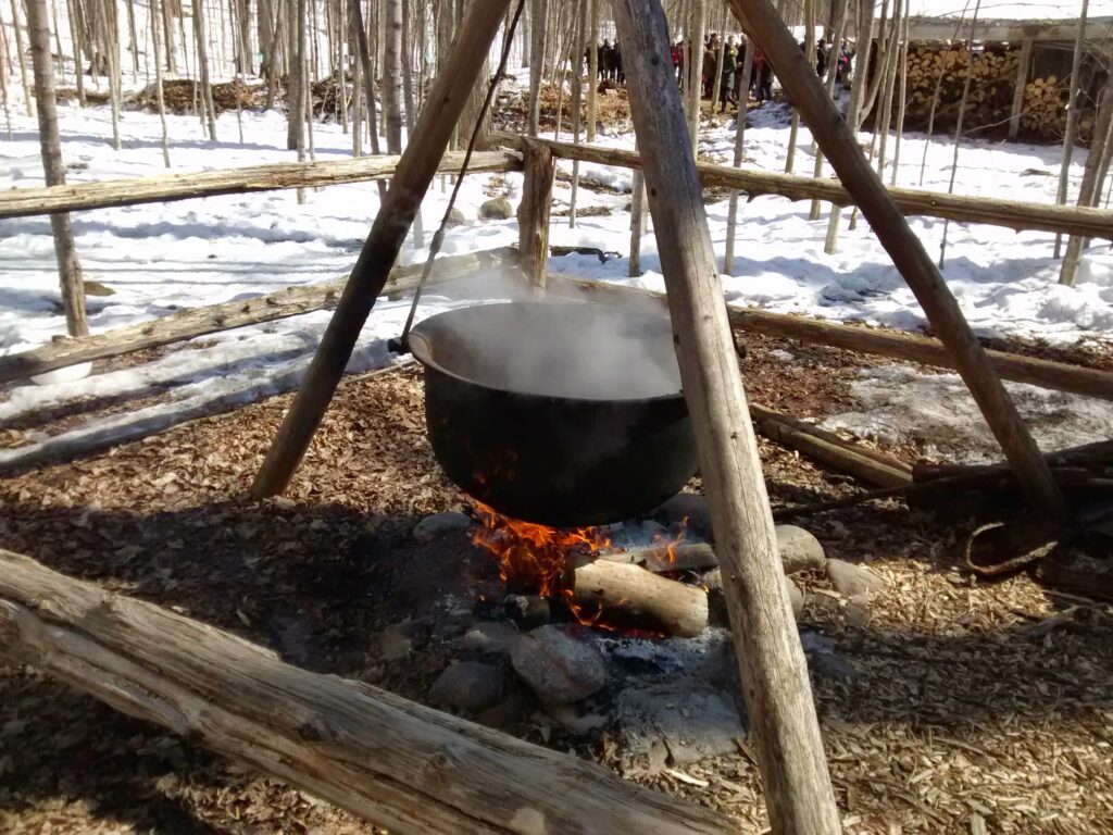 Making maple syrup over an open fire